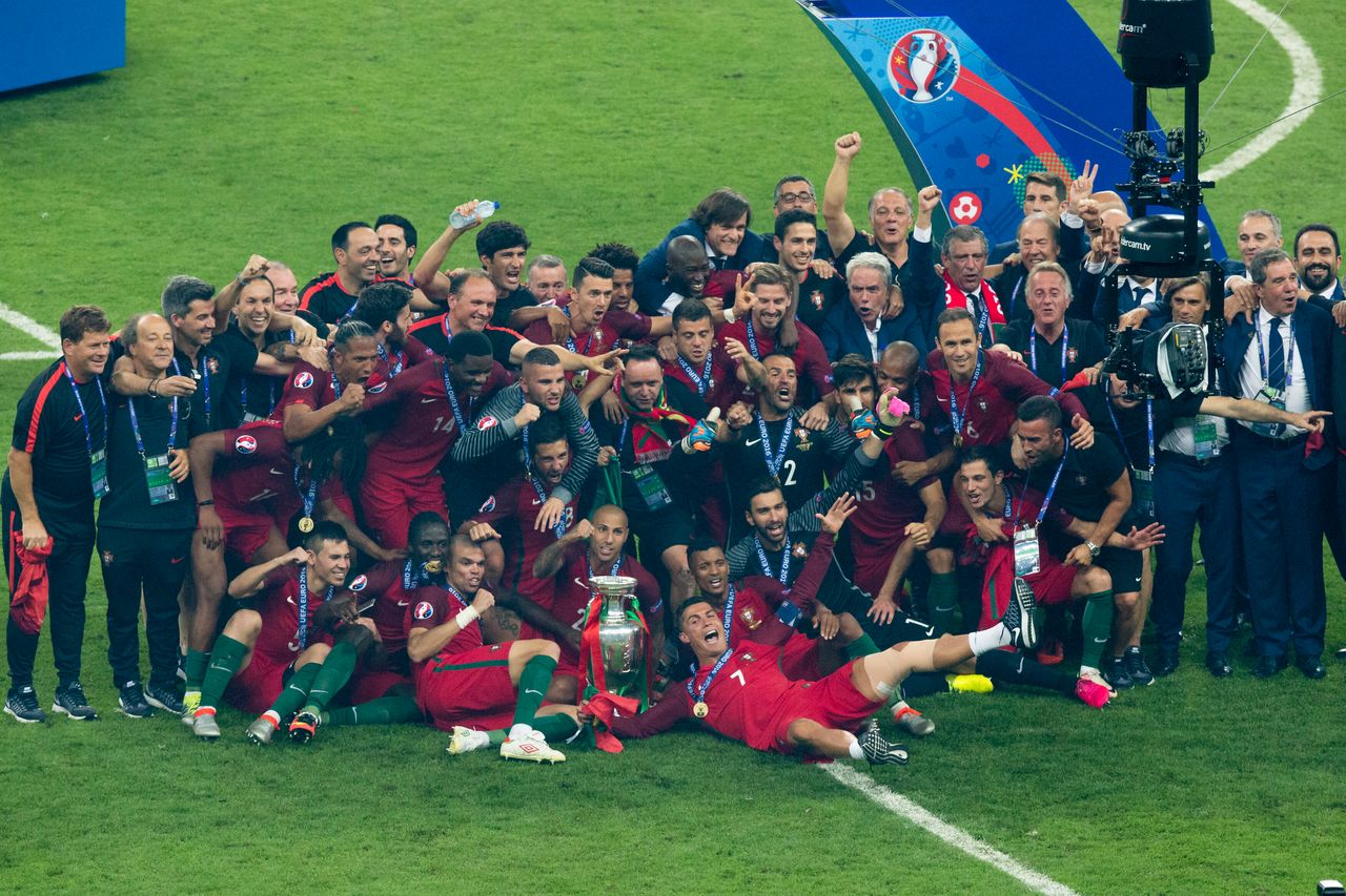 Portugal players celebrate with the winners trophy during the UEFA Euro 2016 Final match between Portugal and France 