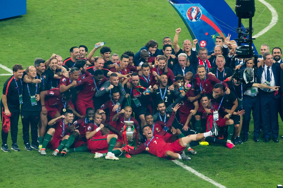 Portugal players celebrate with the winners trophy during the UEFA Euro 2016 Final match between Portugal and France 