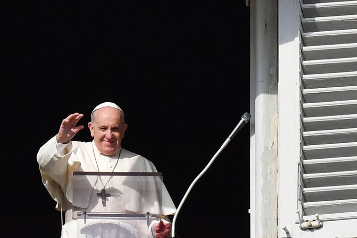 Pope Francis waves as he addresses the crowd from a window overlooking St Peter's Square during his weekly Angelus prayer at the Vatican earlier this month.