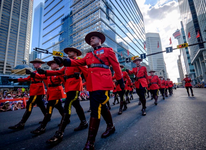 RCMP members march during the Calgary Stampede parade in Calgary, on July 7, 2017. 