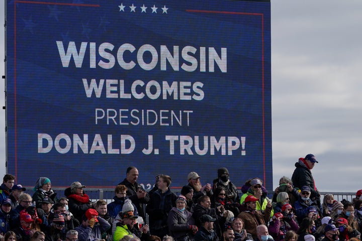 Supporters wait for President Donald Trump to speak at an Oct. 30 campaign rally at the Austin Straubel Airport in Green Bay, Wisconsin.