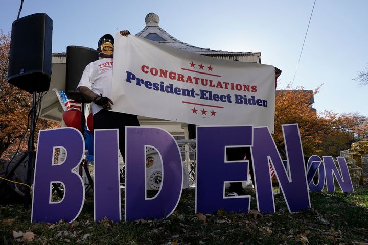 Joe Biden supporters in Milwaukee react to the announcement on Nov. 7 that Biden defeated Trump in the presidential election.