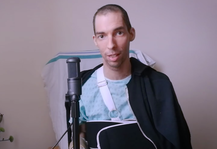 Rémy Bélanger de Beauport is seen here in a screenshot from a video he posted Wednesday on Facebook. The professional cellist had to have a finger reattached after the gruesome sword attack in Quebec City on Oct. 31. 