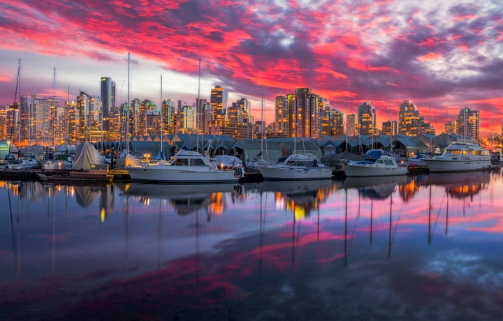 In this undated file photo, yachts sit in a marina at Coal Harbour in Vancouver. Canadians overwhelmingly back a wealth tax on fortunes above $20 million, a new Abacus poll has found.