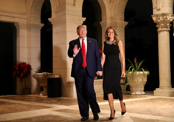 President Donald Trump and first lady Melania Trump arrive to their Christmas Eve party at Trump's Mar-a-Lago resort in Palm Beach, Florida, December 24, 2019. 