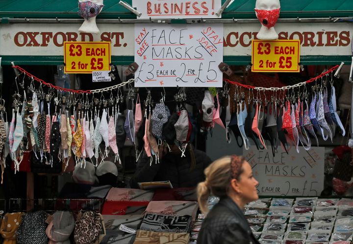 A shop sells face masks on Oxford Street in London, Tuesday, October 13.