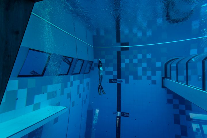 A diver is seen in the deepest pool in the world with 45.5-metre (150-foot) located in Mszczonow about 50 km from Warsaw, November 21, 2020. - The complex, named Deepspot, even includes a small wreck for scuba and free divers to explore. It has 8,000 cubic metres of water -- more than 20 times the amount in an ordinary 25-metre pool. (Photo by Wojtek RADWANSKI / AFP) (Photo by WOJTEK RADWANSKI/AFP via Getty Images)