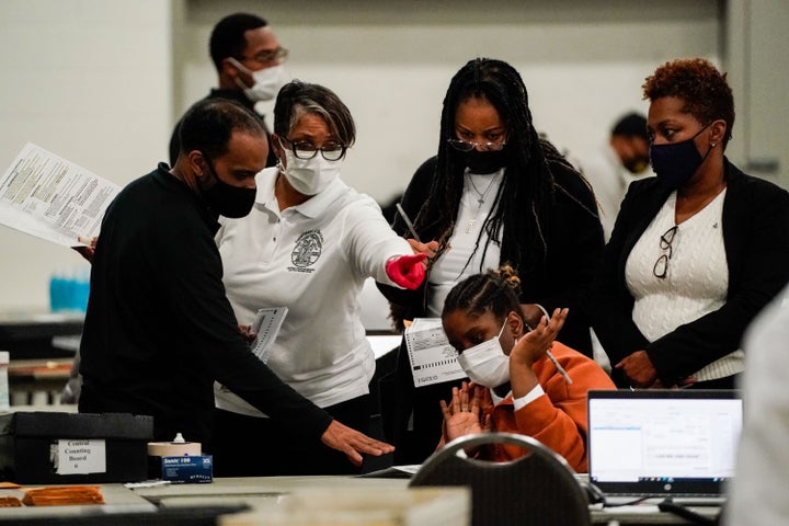 DETROIT, MI - NOVEMBER 04: Election workers process a ballot final stretch of absentee ballot counting at the Detroit Department of Elections Central Counting Board of Voting absentee ballot counting center at TCF Center, Wednesday, Nov. 4, 2020 in Detroit, MI. With the surge in vote by mail/absentee ballots, analysts cautioned it could take days to count all the ballots, leading some states to initially look like victories for President Trump only to later shift towards democratic Presidential candidate Joe Biden. (Kent Nishimura / Los Angeles Times via Getty Images)