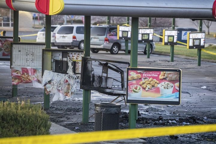 Video obtained by news outlets showed a vehicle on fire in the restaurant's parking lot where four people were shot.