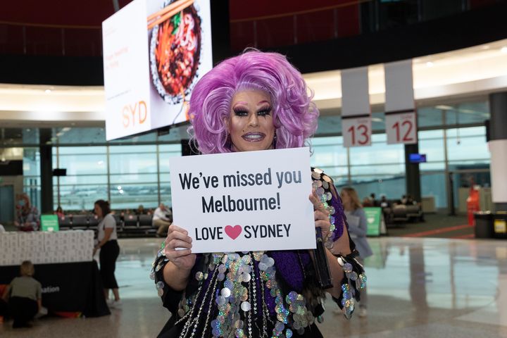 Drag Queen Penny Tration sets up to greet arrivals at Sydney Airport on on November 23, 2020 in Sydney, Australia. 