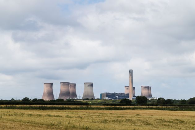 Fiddlers Ferry power station behind a field of wheat in Cheshire, England seen in August 2020.