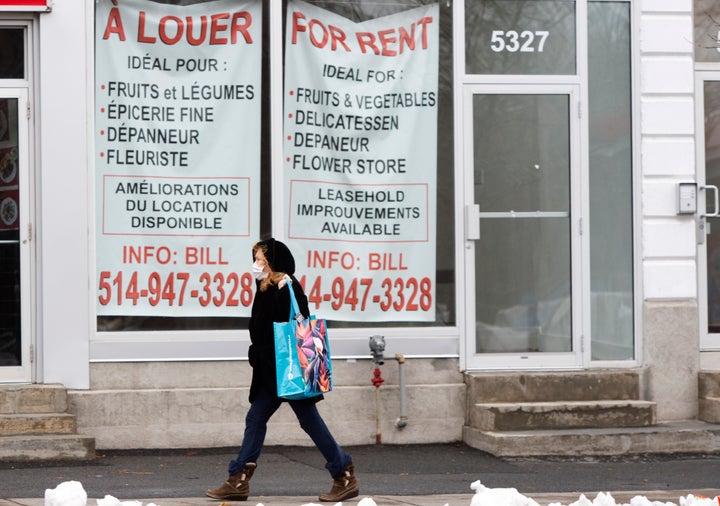 A pedestrian walks past a vacant storefront as the COVID-19 pandemic continues to impact small businesses on Nov. 23, 2020 in Montreal.