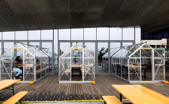 A diner eats in a plastic "house" tent at Industry Kitchen in Lower Manhattan on Oct. 26.