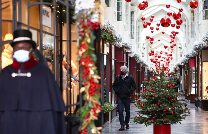 People walk through the Burlington Arcade adorned with Christmas decorations, amid the coronavirus disease (COVID-19) outbreak, in London, Britain, November 23, 2020. REUTERS/Henry Nicholls