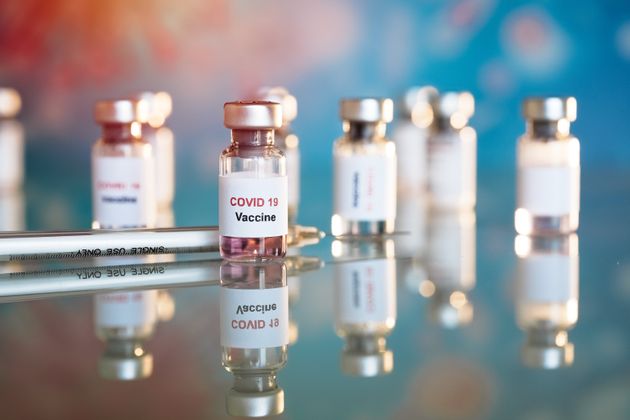A stock photo of vaccine and syringe injection used for prevention, immunization and treatment from COVID-19.