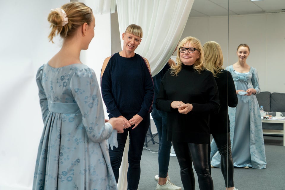 Costume designer Ellen Mirojnik working to fit one of the 7,500