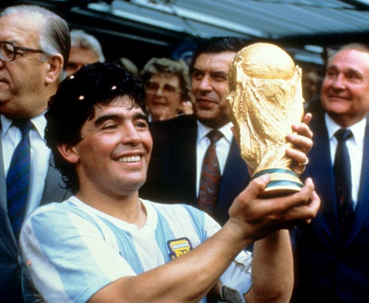 Diego Maradona holds up the World Cup trophy in 1986.