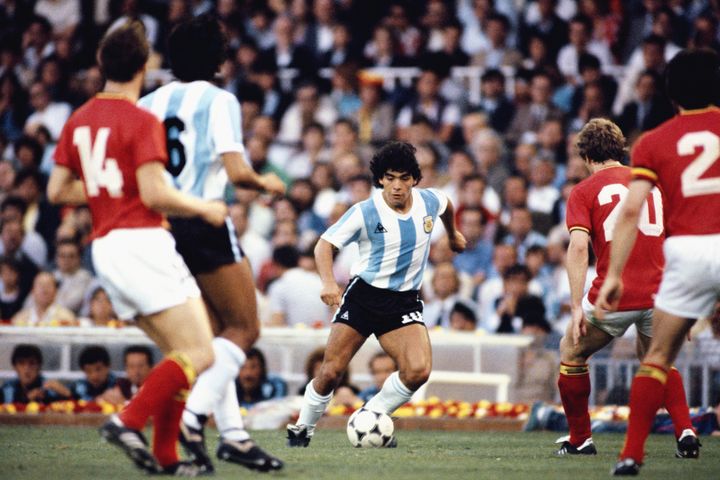 BARCELONA, SPAIN - JUNE 13: Argentina player Diego Maradona (c) takes on the Belguim defence during the 1982 FIFA World Cup match between Argentina and Belguim at the Nou Camp stadium on June 13, 1982 in Barcelona, Spain. (Photo by Steve Powell/Allsport/Getty Images)