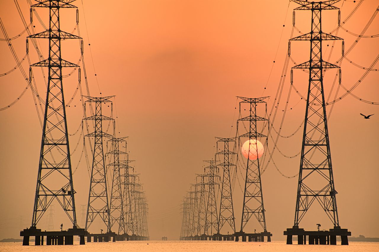 The sun rises behind Sihwa Lake Pylon VD702. The Sihwa Lake Tidal Power Station in South Korea is the world's largest tidal array.