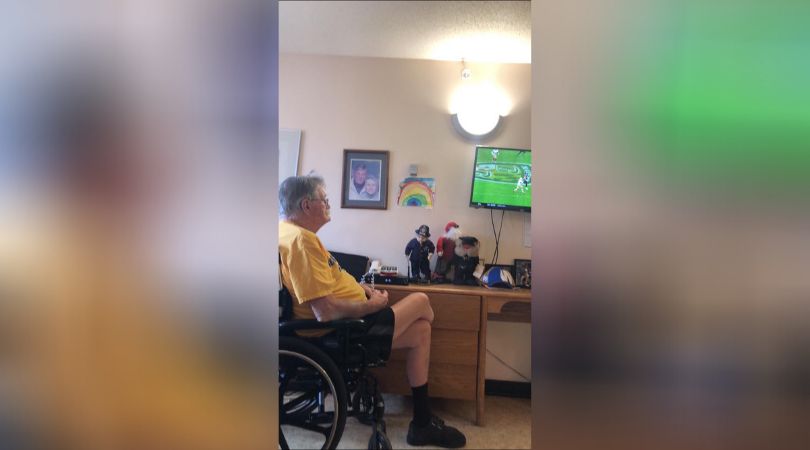 Glen Baillie watches football in his room at Maples Personal Care Home.