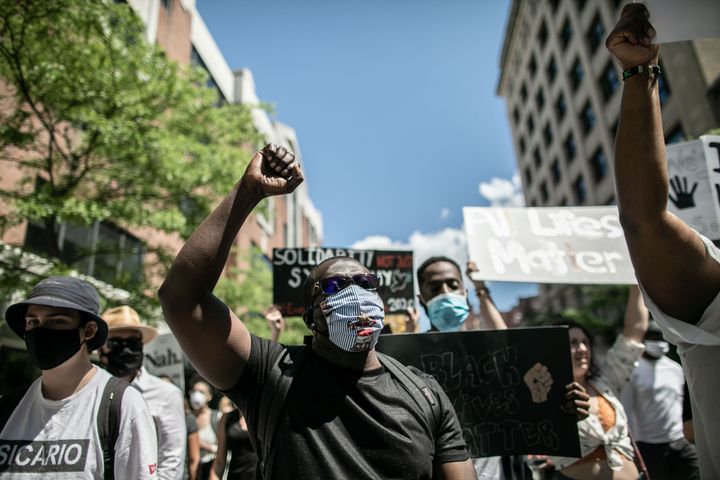 Protesters march against police brutality and racism in Montreal on June 7. 
