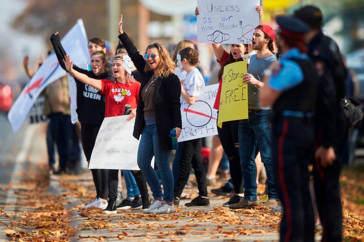 Anti-mask protesters march outside the community centre in Aylmer, Ont., on Nov. 7.