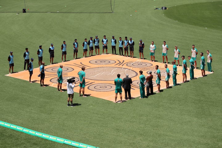 Australian and Indian players participate in a Barefoot Ceremony ahead of game one of the One Day International series between Australia and India at Sydney Cricket Ground on November 27/