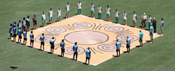 The Australia and India teams form a Barefoot circle in support of Black Lives Matter before game one of the One Day International series between Australia and India at Sydney Cricket Ground on November 27.