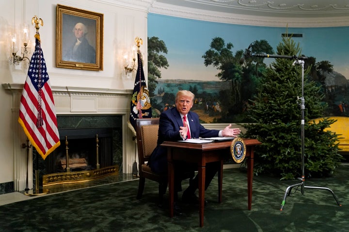 President Donald Trump spoke with reporters following a video chat with members of the military, and the tiny desk he sat at became a meme.