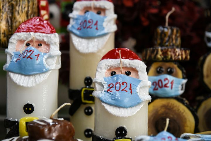 Christmas candles depicting Santa Claus wearing a protective mask are displayed at shop in Thessaloniki, Greece