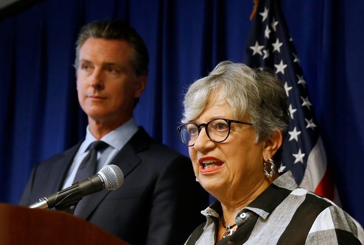 California Air Resources Board Chair Mary Nichols, flanked by Gov. Gavin Newsom, left, discusses the Trump administration's pledge to revoke California's authority to set vehicle emissions standards that are different than the federal standards, during a news conference in Sacramento, Calif., on Sept. 18, 2019.