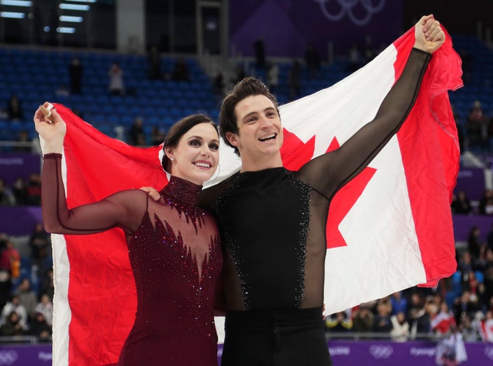 Tessa Virtue and Scott Moir of Canada celebrate after winning the gold medal in the ice dance at the 2018 Winter Olympics in Gangneung, South Korea on Feb. 20, 2018. 
