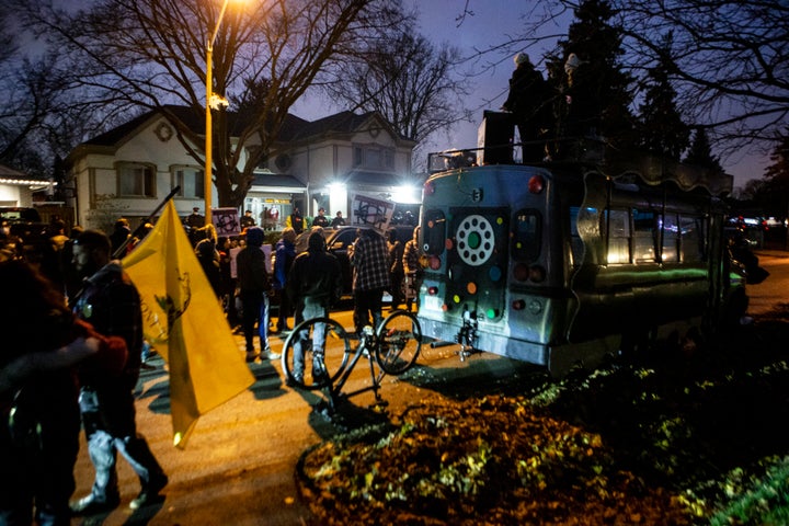 Protesters gather outside of Ontario Premier Doug Ford's home following the arrest of Adam Skelly in Etobicoke, Ont. on Nov. 26, 2020. Skelly owns a BBQ restaurant which opened in defiance of COVID-19 restrictions.