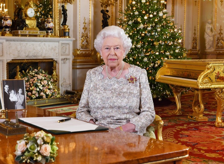 Queen Elizabeth II poses for a photo after she recorded her annual Christmas Day message, in the White Drawing Room at Buckin