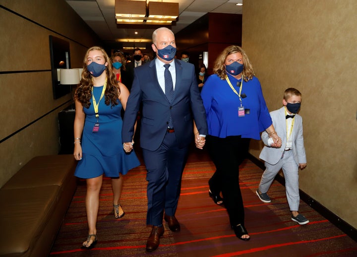 Erin O'Toole walks with his family, wife Rebecca, daughter Mollie, and son Jack, to give his victory speech as the new leader of Canada's main opposition Conservative Party in Ottawa on Aug. 24, 2020.