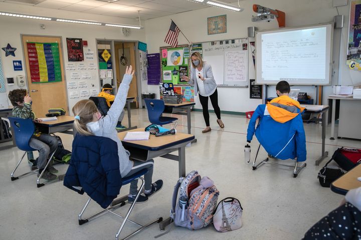 Third grade teacher Cara Denison speaks to students in November while live-streaming her class via Google Meet at Rogers International School in Stamford, Connecticut.