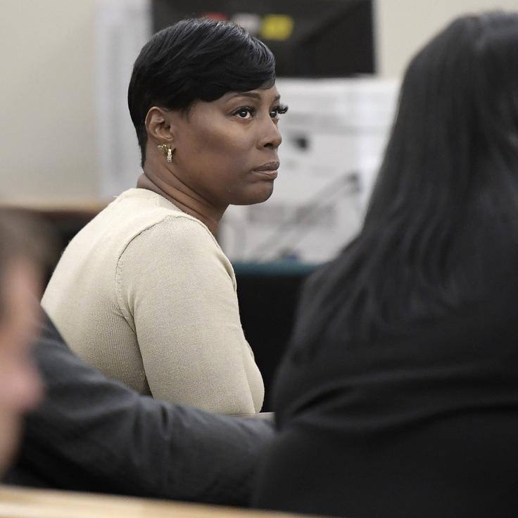 Crystal Mason (middle) was convicted for illegal voting and sentenced to five years in prison in 2018.