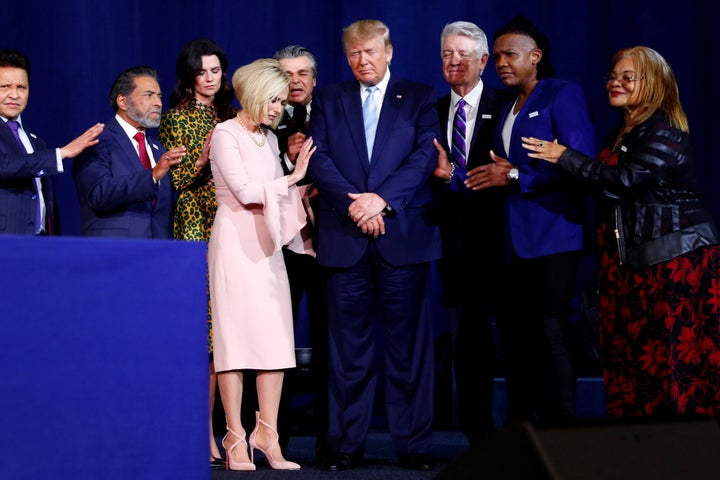 President Donald Trump participates in a prayer before speaking at an Evangelicals for Trump coalition launch at the King Jesus International Ministry in Miami on Jan. 3, 2020.