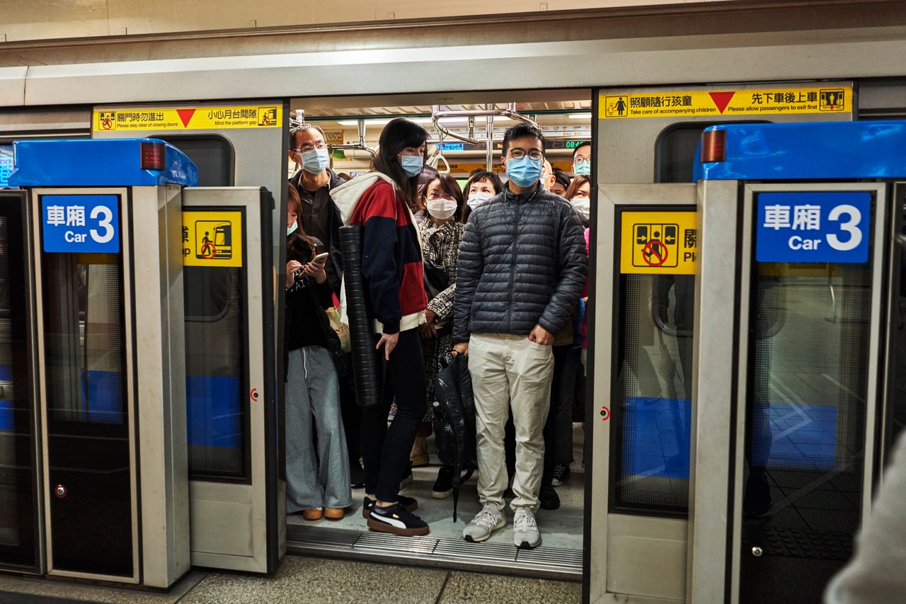 Commuters wear face masks in Taiwan, which has seen more than 200 days without a single recorded case of Covid-19.