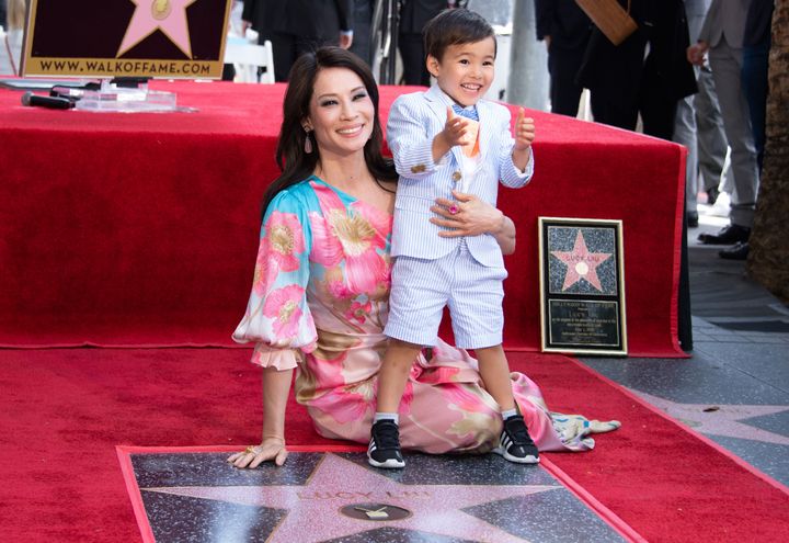 Lucy Liu and her son Rockwell Lloyd smile as she receives her star on the Walk of Fame during a ceremony in Hollywood in May 2019.