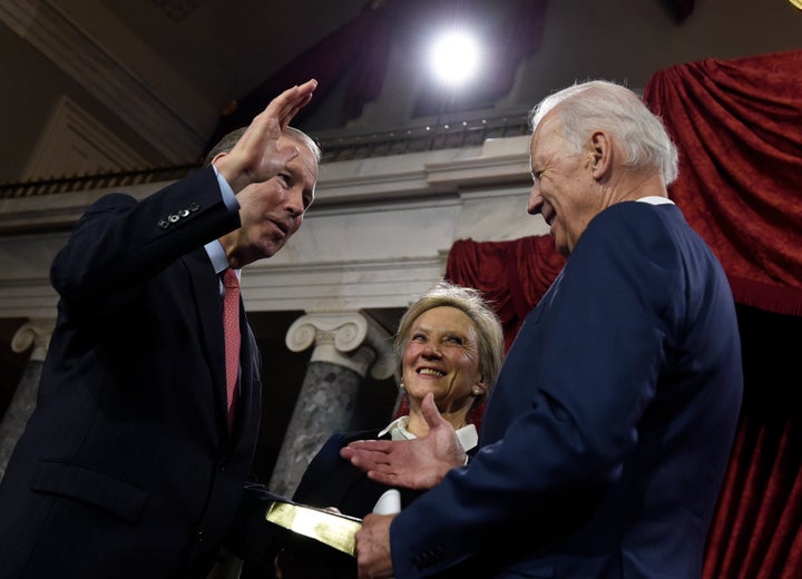 Sen. Tom Udall (D-N.M.) is considered a top contender to serve as President-elect Joe Biden's interior chief. Udall and then-Vice President Biden are pictured here during a ceremony in Washington in 2015.