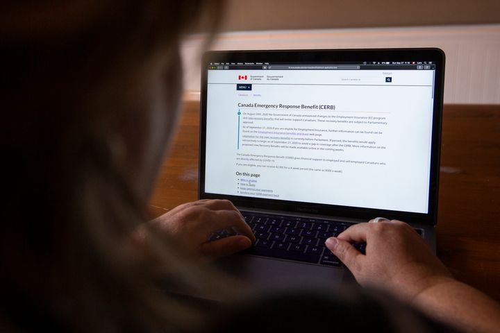 A person looks at the Government of Canada's website for Canada Emergency Response Benefit (CERB) in Kingston, Ontario on Sept. 27, 2020. 