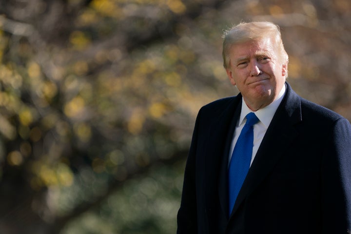 President Donald Trump walks on the South Lawn of the White House in Washington, Sunday, Nov. 29, 2020, after stepping off Ma