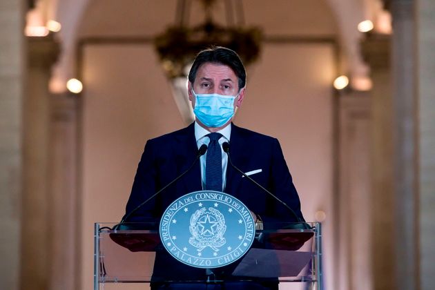 This photo taken on October 18, 2020 and provided by the Italian news agency ANSA shows the Italian Prime Minister ...