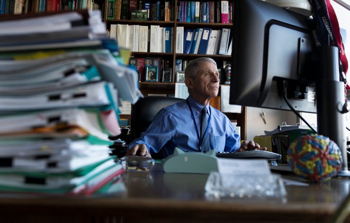 Dr. Anthony Fauci, director of the National Institute for Allergy and Infectious Diseases, works in his office at the National Institutes of Health on Dec. 19, 2017, in Bethesda, Maryland. 