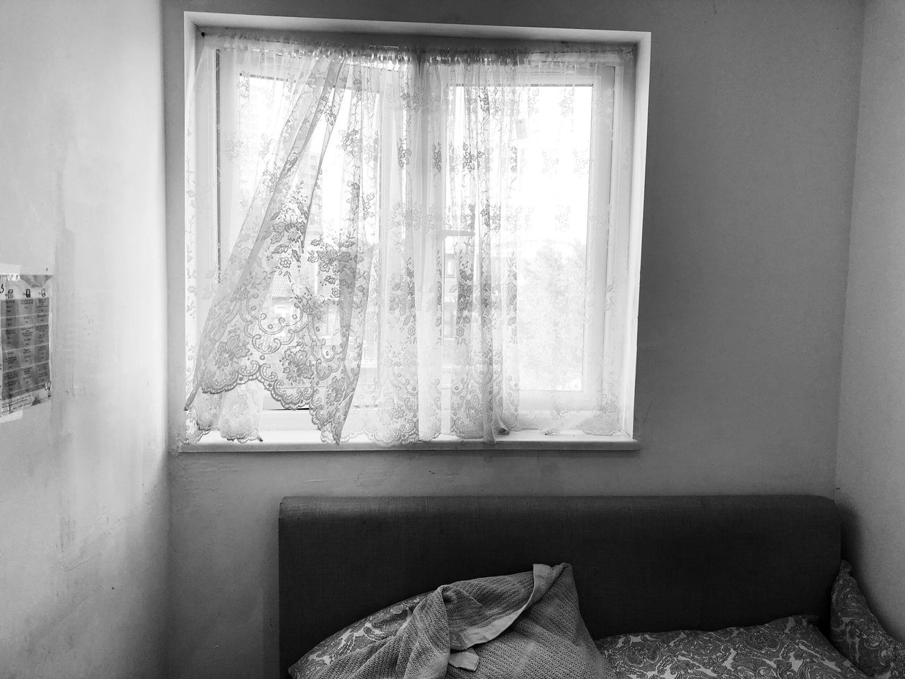 The small bed and window in Rafiat's room.