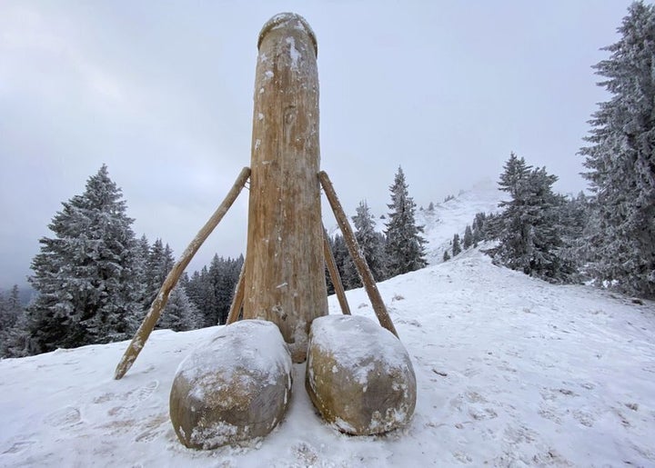A wooden phallus sculpture about two meters high stands on the Gruenten mountain, Rettneberg, Germany, Thursday, Dec. 3, 2020. After the mysterious disappearance of the wooden penis, unknown persons have now created a replacement. On the 1738 meter high Gruenten in the Allgaeuer Alps, there is again a new phallus sculpture, supported by several beams.