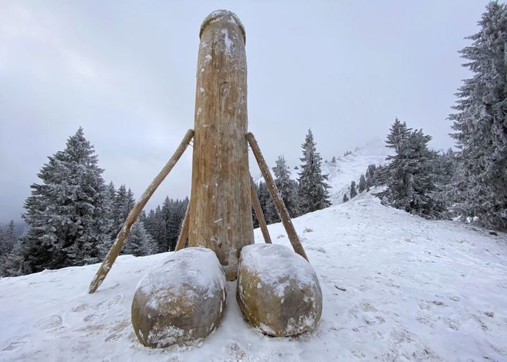 A wooden phallus sculpture about two meters high stands on the Gruenten mountain, Rettneberg, Germany, Thursday, Dec. 3, 2020