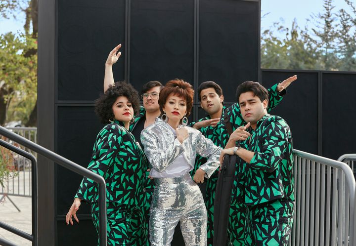 Noemi Gonzalez, left, as Suzette Quintanilla, Hunter Reese Pe&ntilde;a as Ricky Vela, Christian Serratos as Selena Quintanill