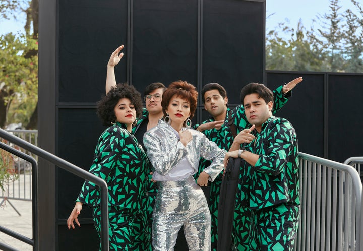 Noemi Gonzalez, left, as Suzette Quintanilla, Hunter Reese Peña as Ricky Vela, Christian Serratos as Selena Quintanilla, Paul Rodriguez Jr. as Roger Garcia and Gabriel Chavarria as A.B. Quintanilla in "Selena: The Series."